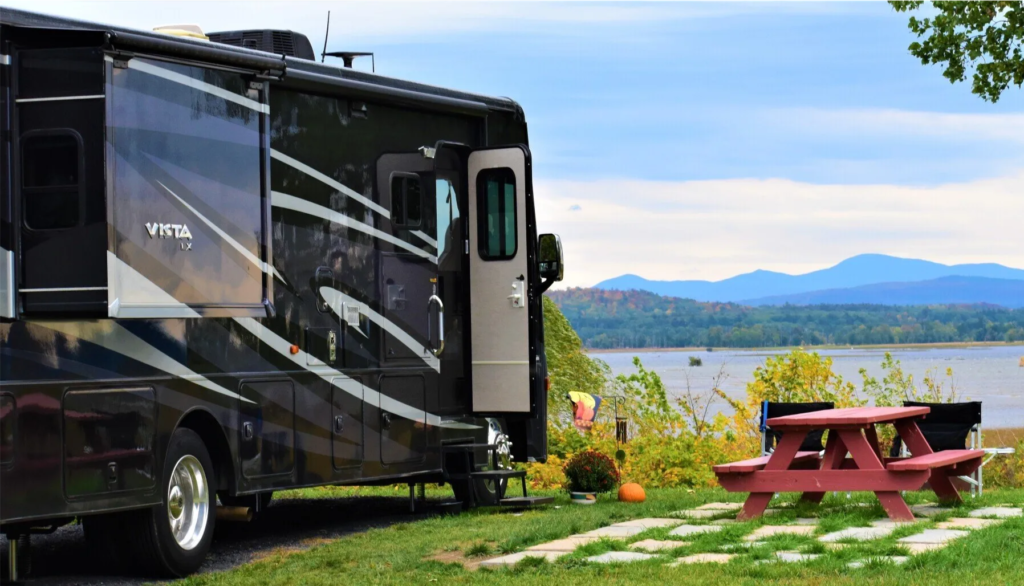 rv parked by lake champlain in vermont