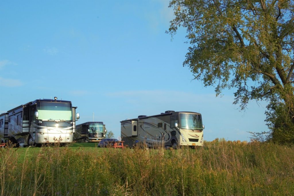 rvs parked by lake champlain in verrmont